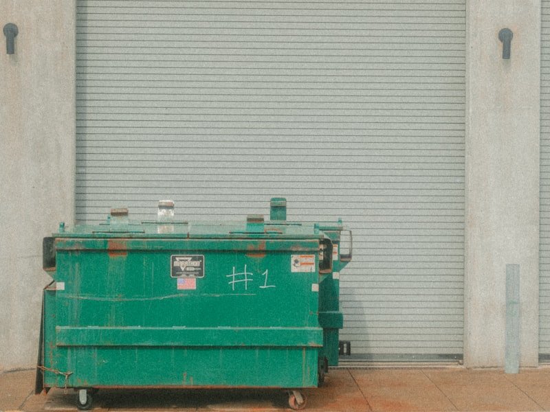 Commercial waste bins at an Ottawa loading dock — the kind of service our team delivers daily